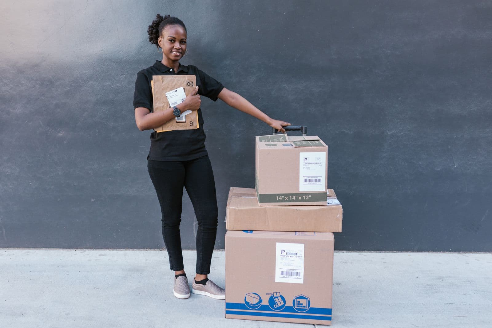 An online seller standing with packed orders
