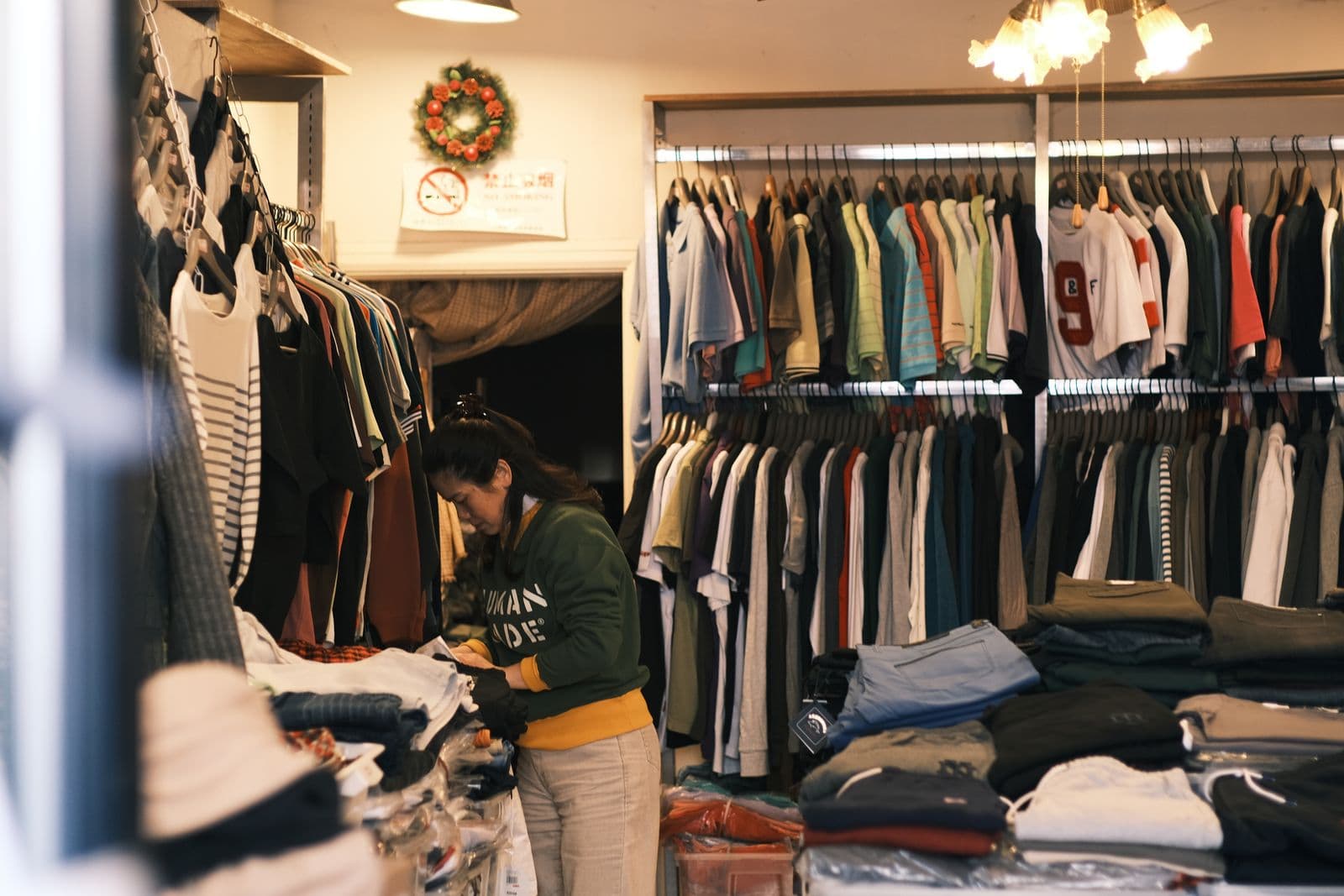 A clothing store with racks of shirts