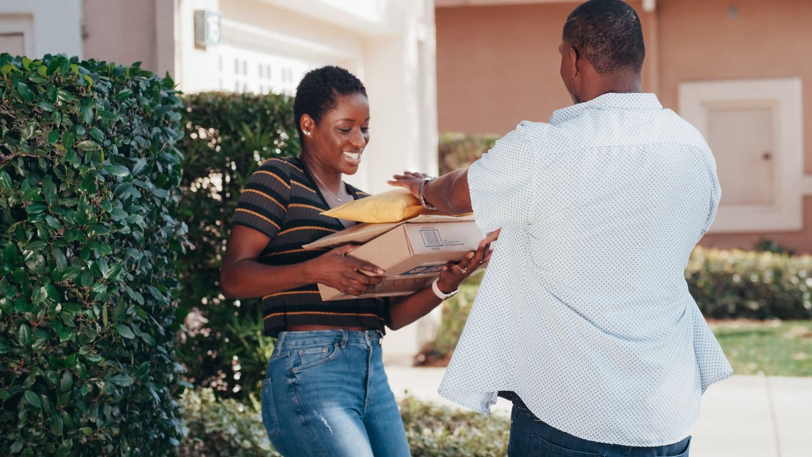 A woman receiving her order from a courier