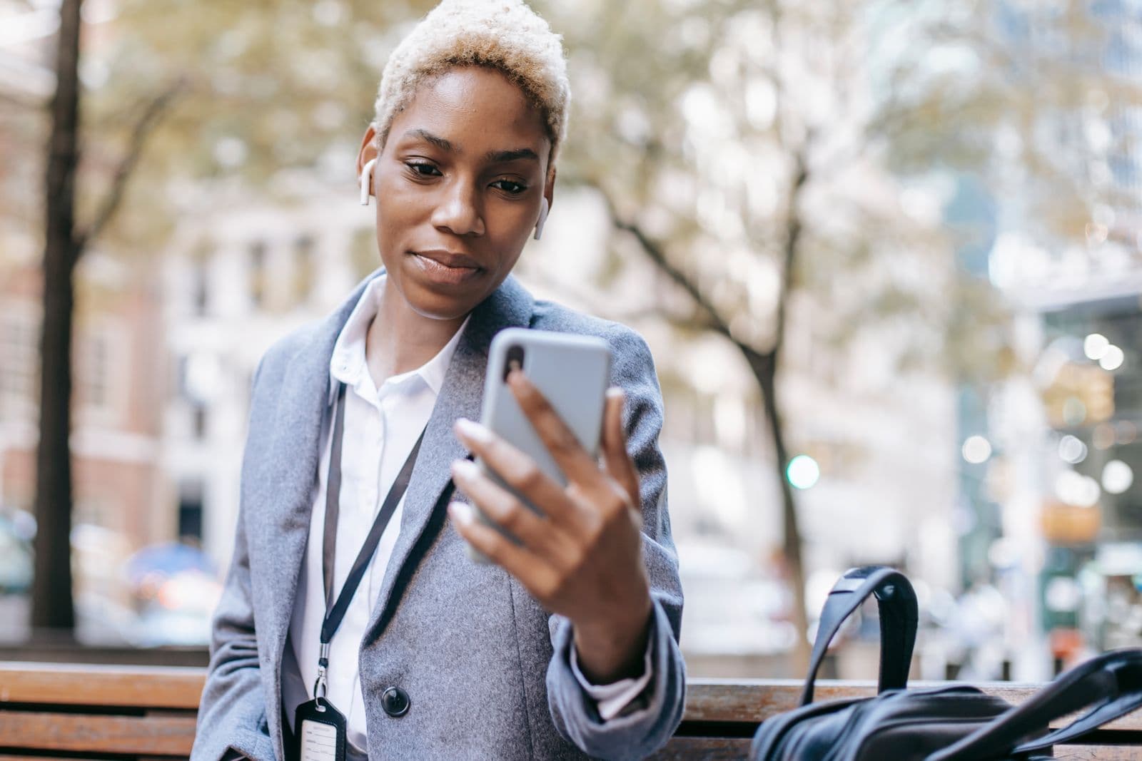 A woman reading a deal invite on her phone